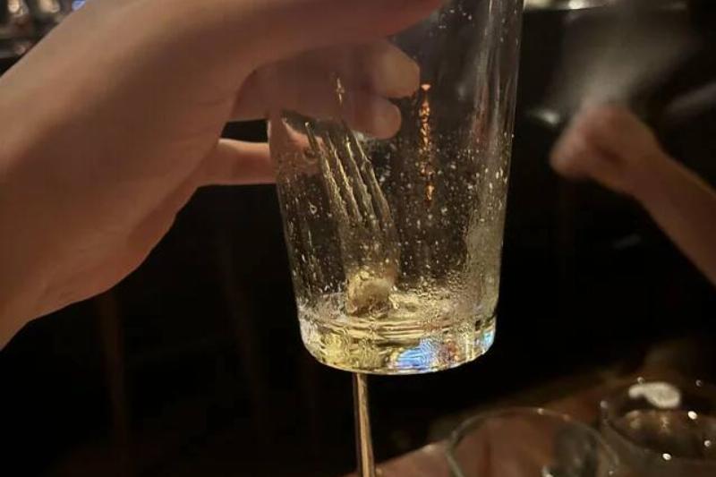 the-waiter-dropped-a-fork-into-my-glass-and-it-created-a-v0-u3hoa6gv24af1