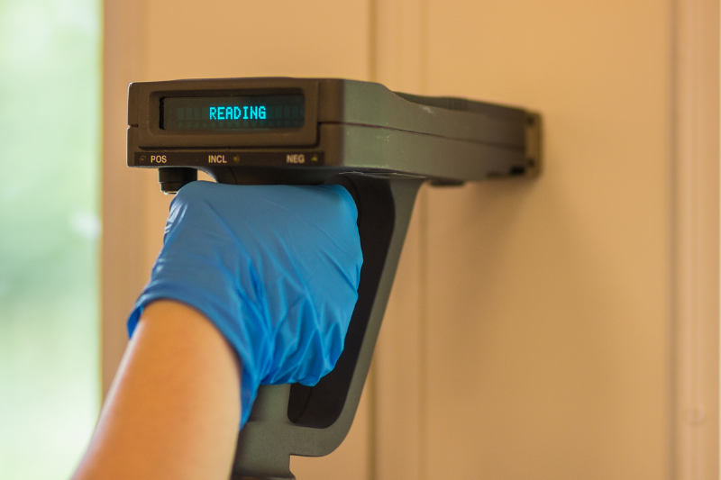 A sensor pressed to a wall.