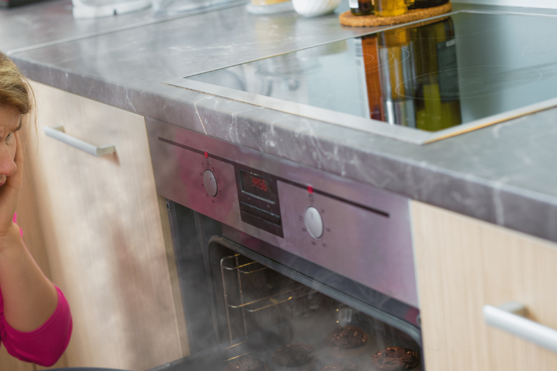 Smoke inside of an oven. 