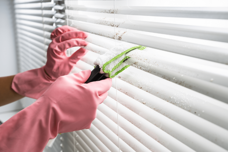 Cleaning blinds.
