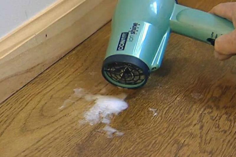 Hair dryer on a wood floor. 