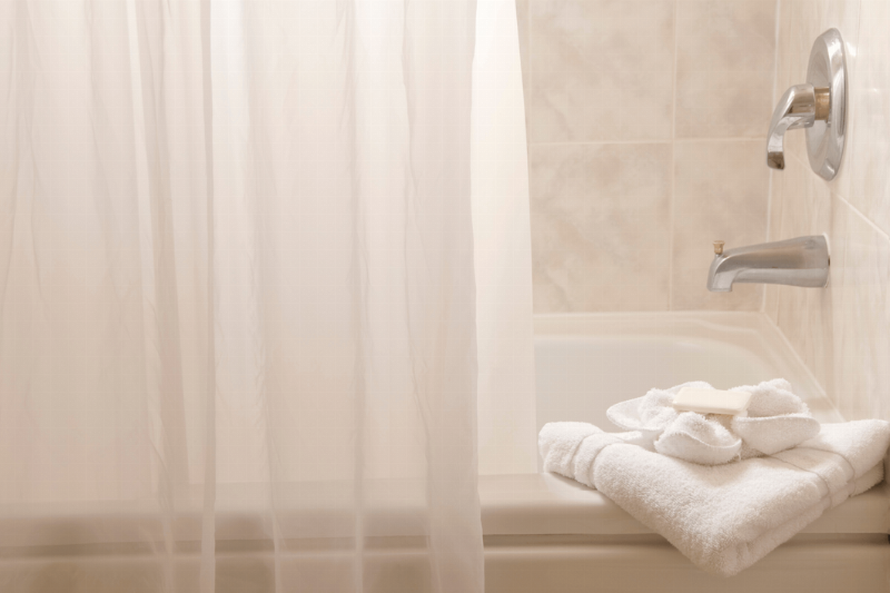 A shower curtain on a bathtub.