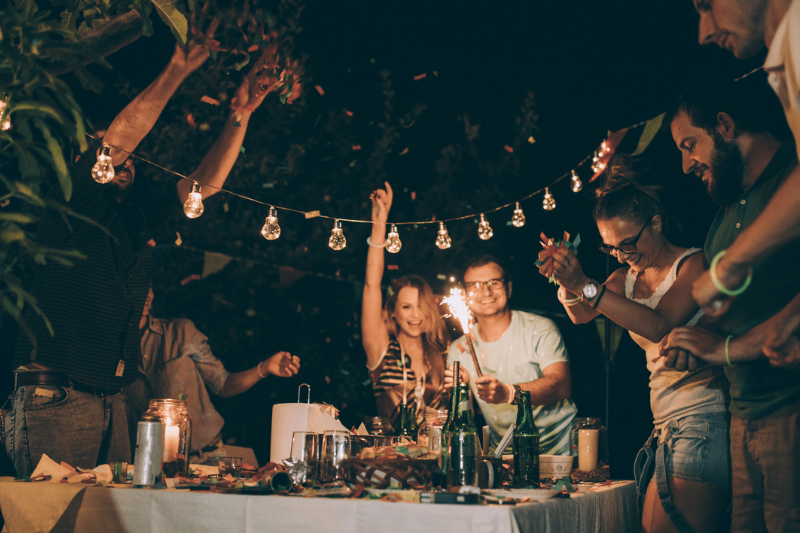A group of young people having an outdoor gathering. 