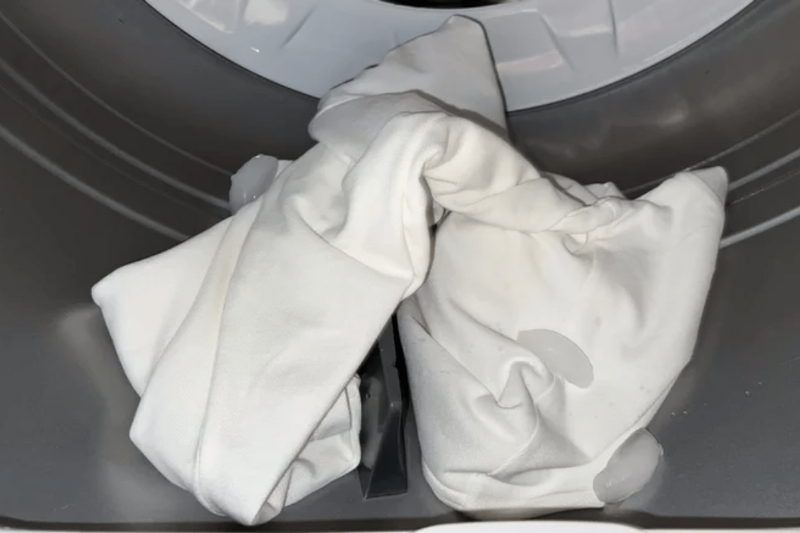 A pillowcase in a dryer. 