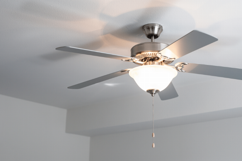 A ceiling fan with a light.