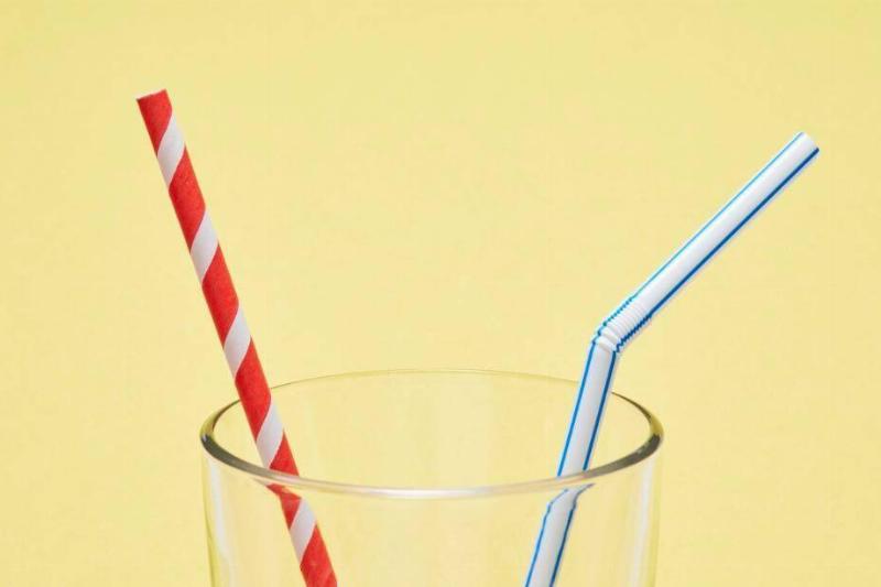 Two straws in a glass. 