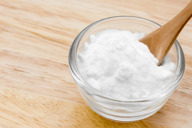 A glass bowl of baking soda. 