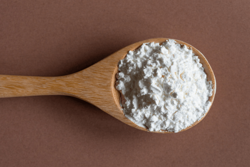 White powder in a wooden spoon.