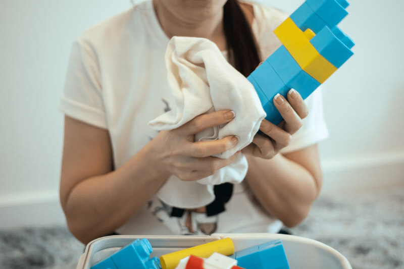 Wiping blocks with a cloth.