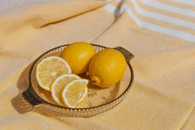 Slices of lemon on a yellow blanket.