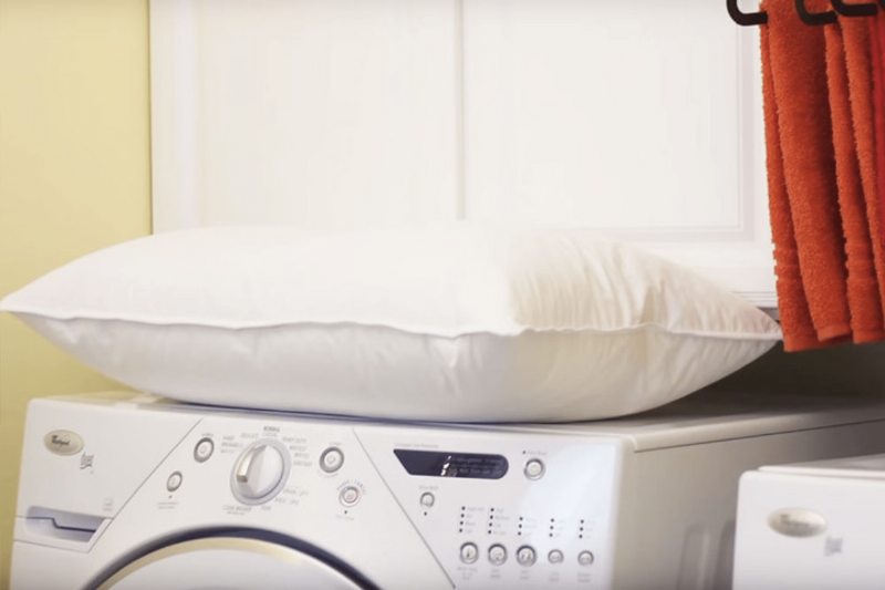A pillow on a dryer.