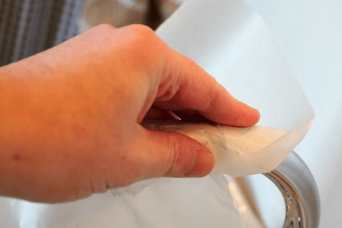 Cleaning a faucet.