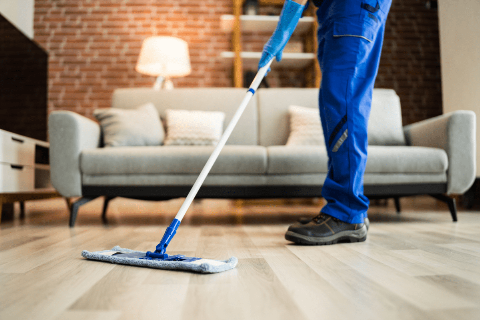 A man cleaning a floor.