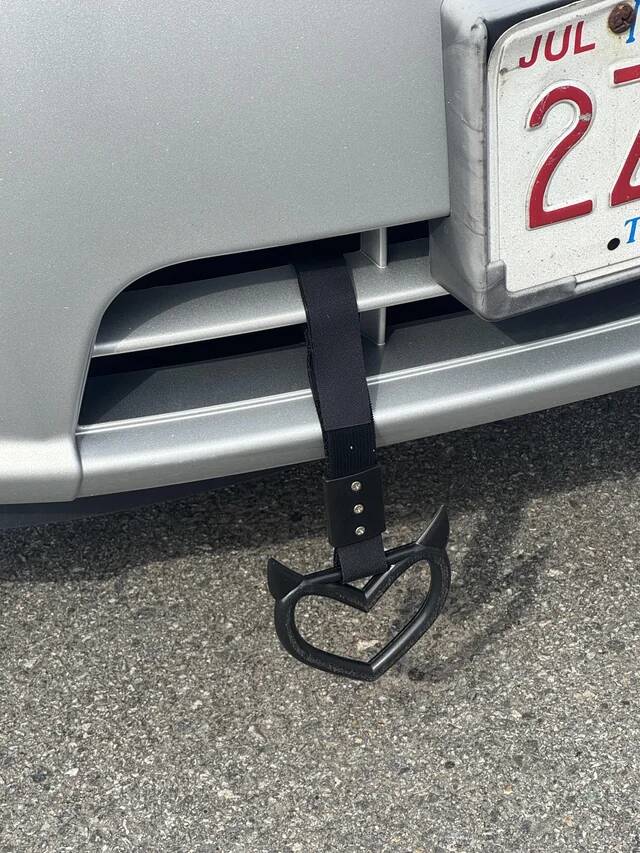 a-metal-pointy-thing-dangling-from-the-front-of-the-car-v0-t9jz2cxirmqg1