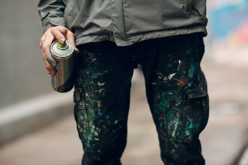 Paint on the pants of a graffiti artist. 