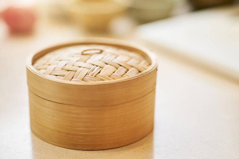 A bamboo steamer basket. 