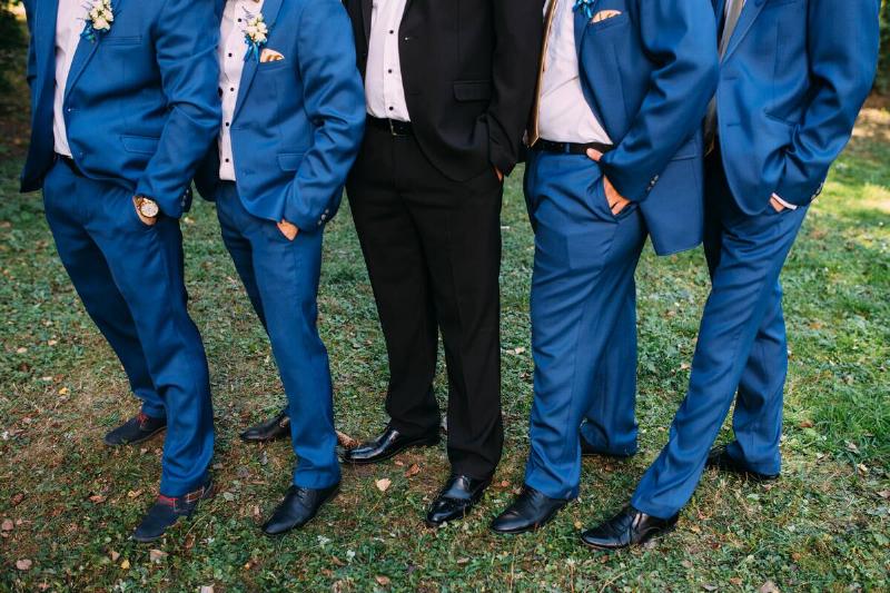 Groom With Best Man And Groomsmen At Wedding.