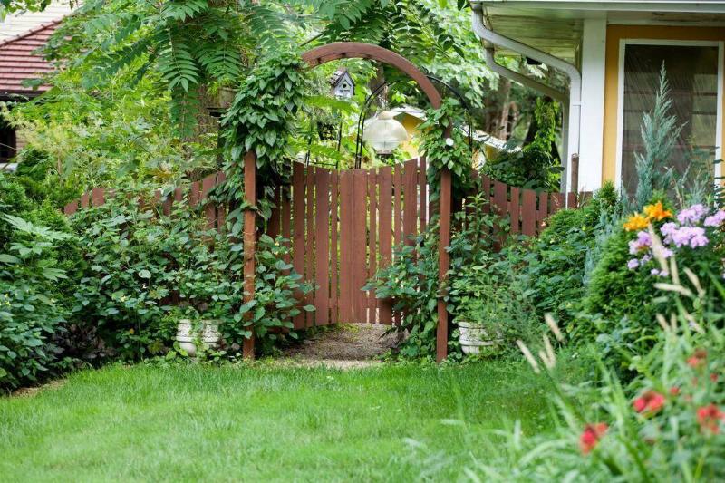A gate by a house. 