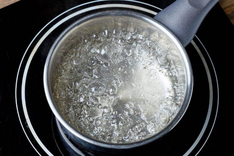 Water boiling on a stove. 