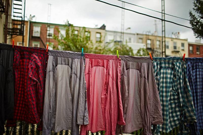 Shirts hanging on a clothes line. 