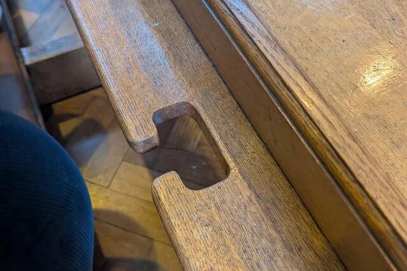 what-are-these-slots-cut-in-the-back-of-the-pews-in-a-v0-xd2zx827o8ff1