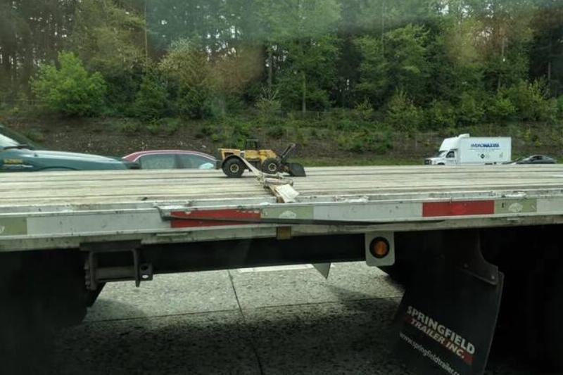 while-driving-past-a-tractor-trailer-truck-on-the-highway-v0-dfqbp7c5rhu21
