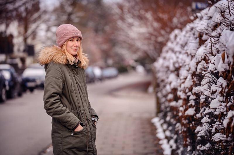 Woman wearing a parka in winter. 