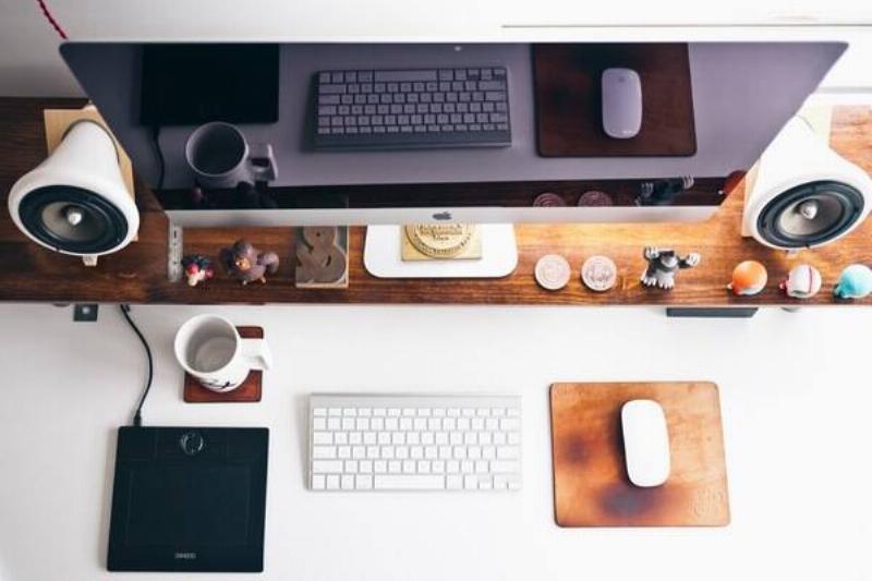 A computer on a desk. 