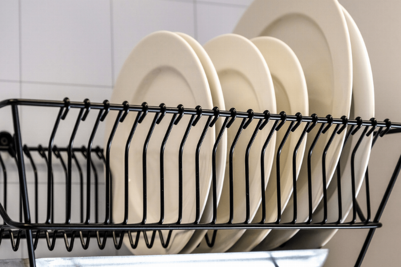 Dishes drying in drying rack.