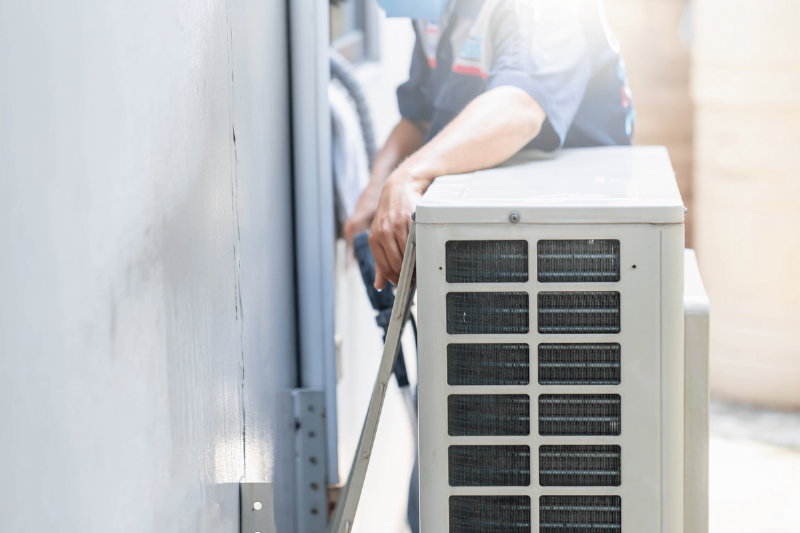 Man with an air conditioner.