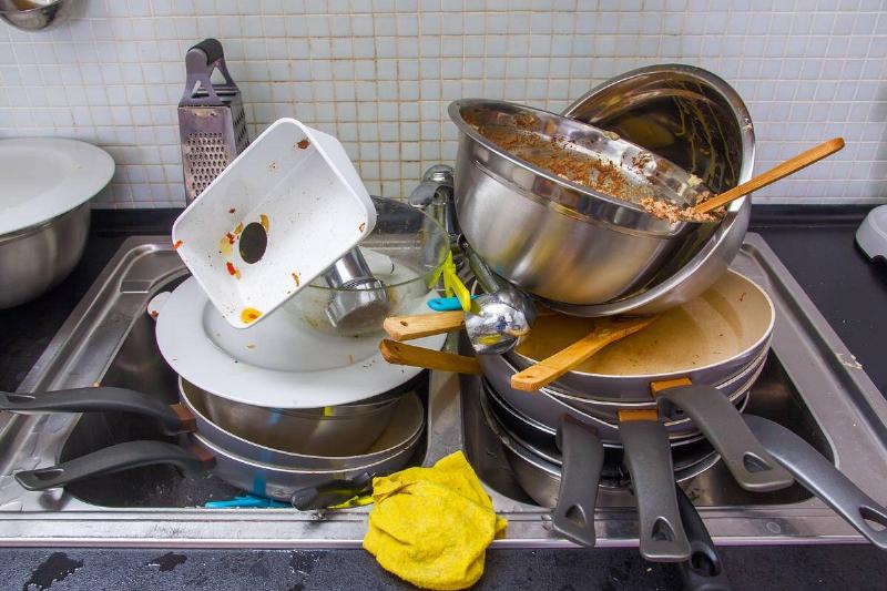 Dirty dishes in a sink.