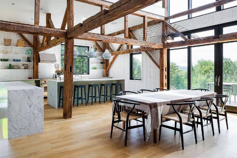 Modern barn home with spacious interior in white with ample natural light.