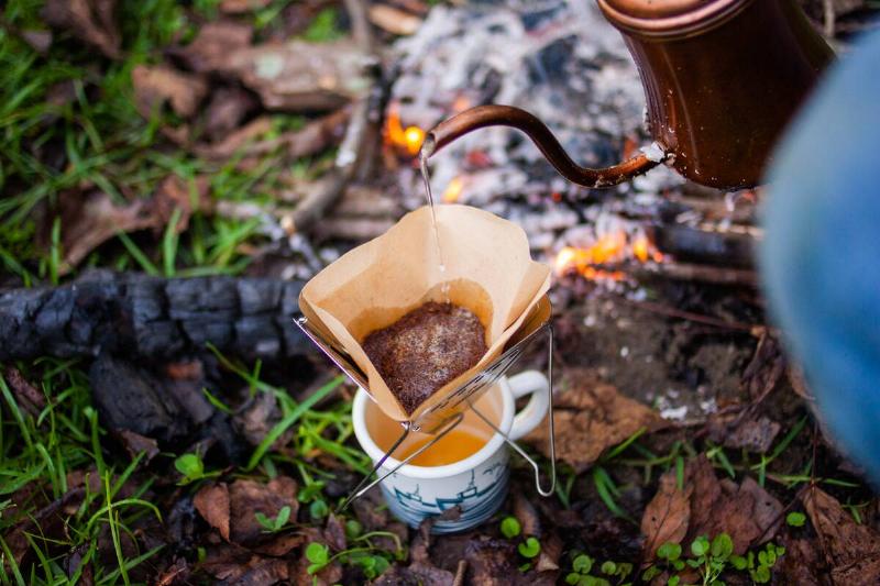 Pouring water into camping filter.