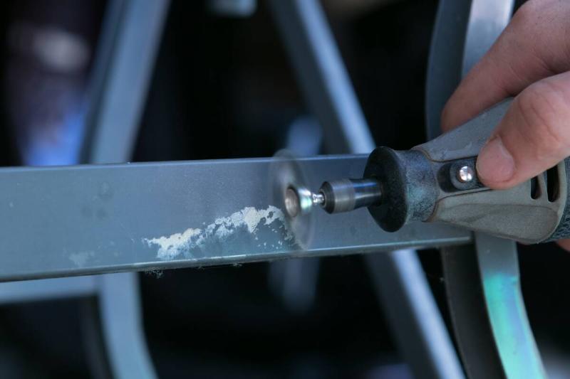 Removing glue with a wire wheel attachment. 