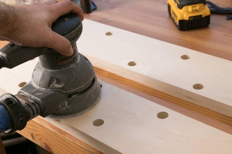 Sanding the wood. 