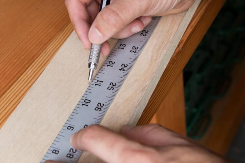 Measuring marks on a piece of wood. 