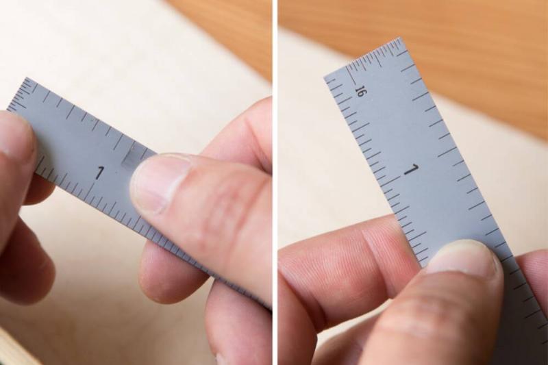 Wiping marks off a ruler. 