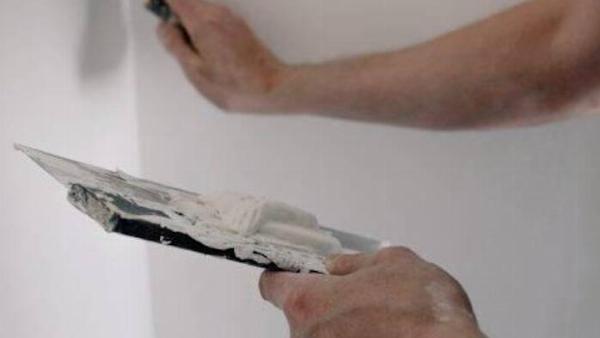 Repairing a wall. 