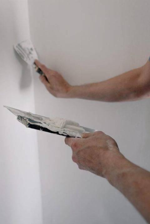 Repairing a wall. 