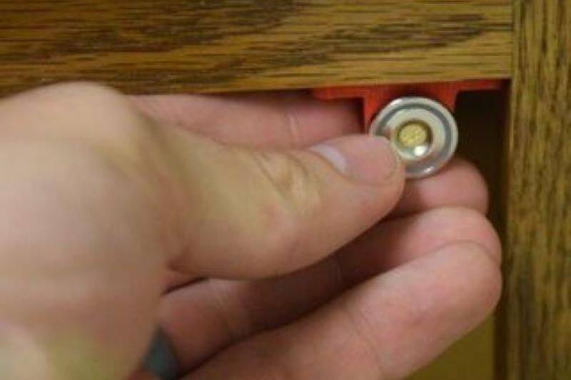 Magnet on cabinet door.