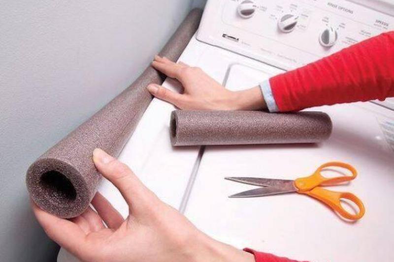 Pool noodle beside dryer.