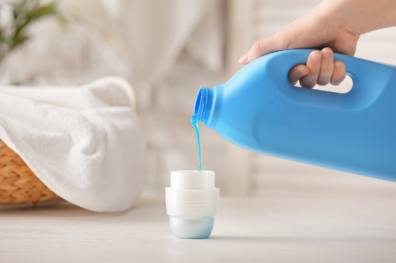 Pouring bottle of detergent.