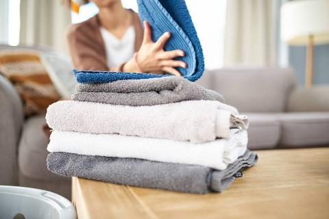 Folding clean towels.