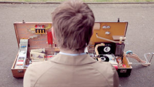 A Postcard-Writing Rube Goldberg Machine in a Vintage Suitcase