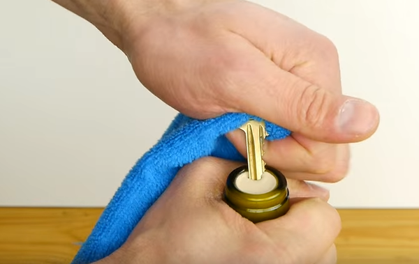 how to open a wine bottle with a key