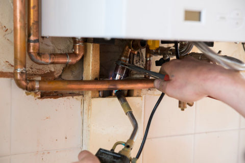 A copper pipe being welded