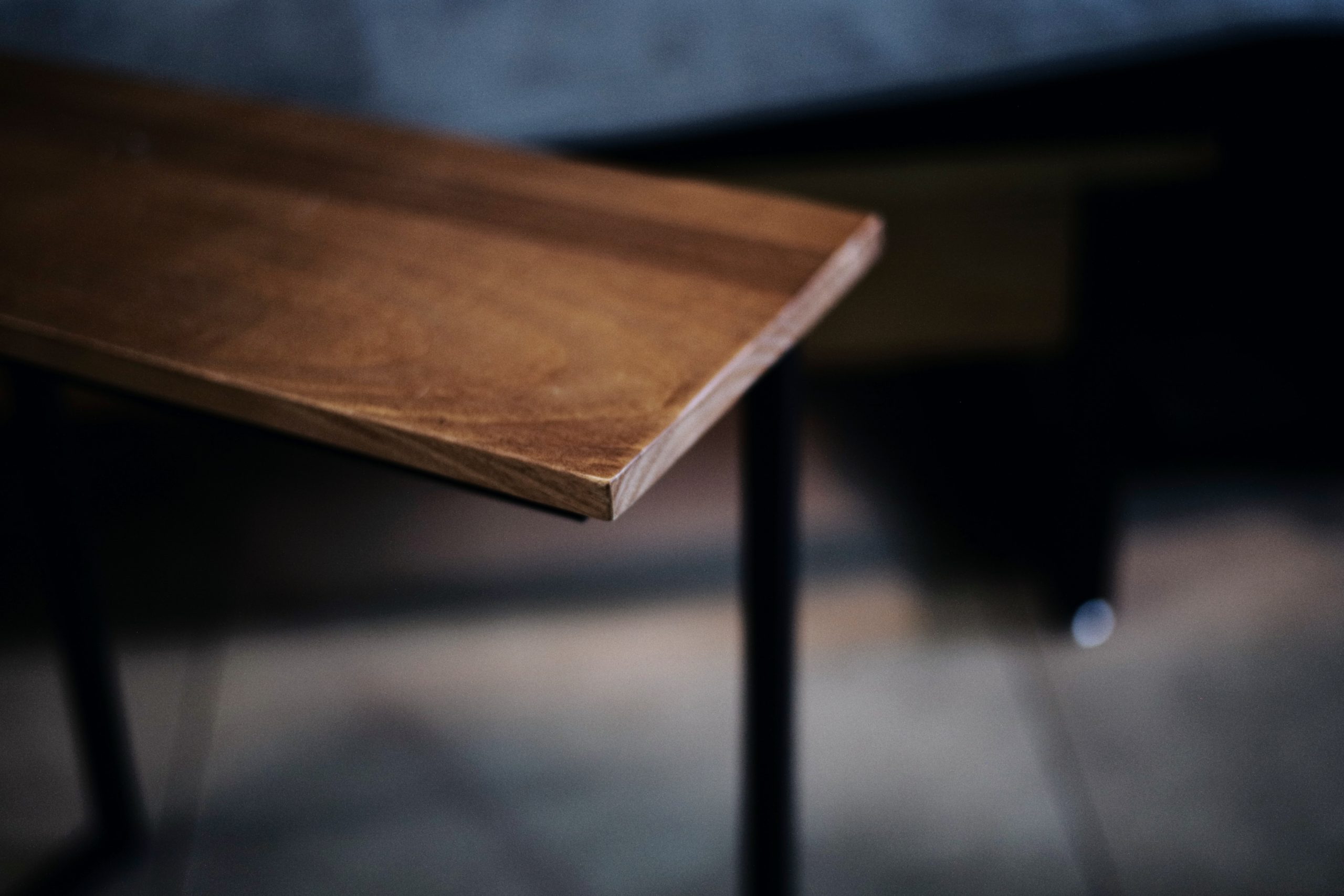 wood board on sawhorse stained a chestnut brown