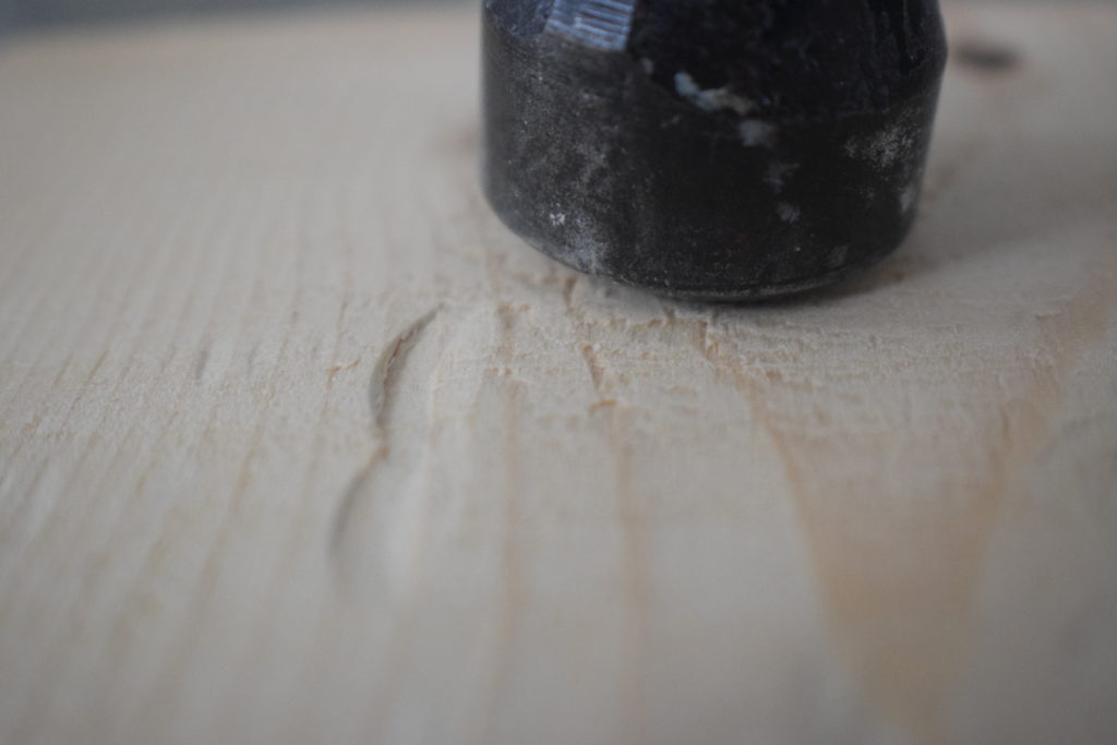 Hammer marks on soft pine wood