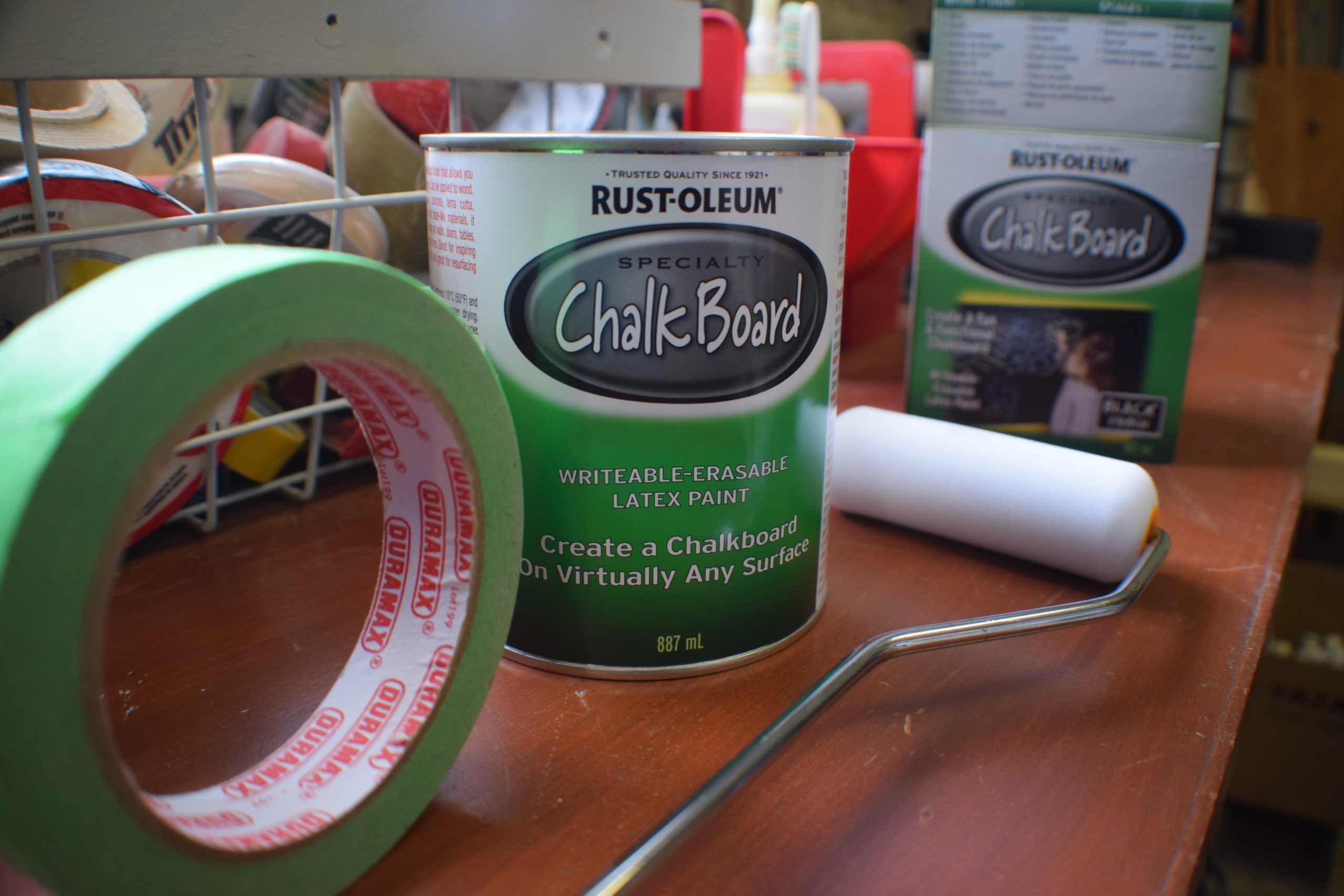 Supplies for painting a chalkboard wall on a tool bench