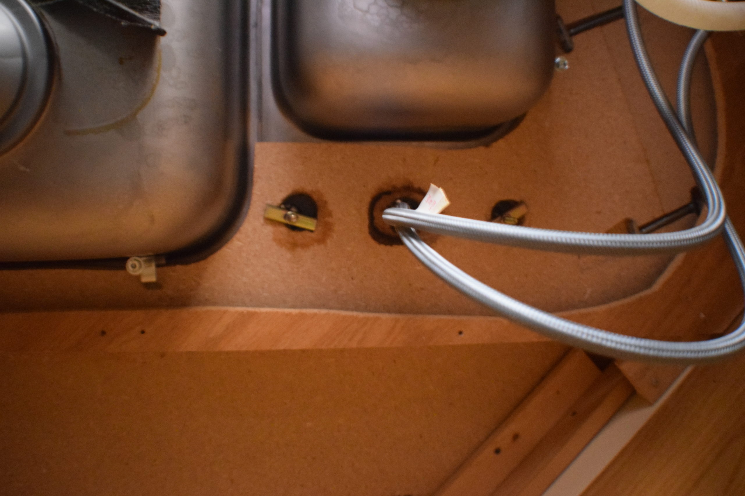 Holes under kitchen sink